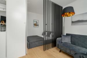 Dark Grey One Bedroom Apartment in Poznań with Balcony by Renters