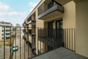 Dark Grey One Bedroom Apartment in Poznań with Balcony by Renters