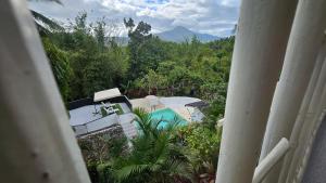 A Touch of Pink Secret Eco Retreat with Pool, Starlink WiFi, Netflix, Mountain Views - Peaceful Stay in Puerto Princesa Near Underground River, Firefly Watching, and Waterfalls - Perfect Stop Between El Nido, Port Barton, and Puerto City - Scooter Re
