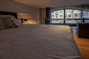 Appartements Manhattan Loft - centre - 5 mn a pied gare - parking prive - patio : photos des chambres