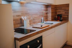 Appartements L-Exile • l-Oasis de tranquillite en Coeur de Ville : photos des chambres