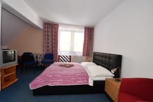 Quadruple Room with Balcony and Extra bed room in Penzion Lesna
