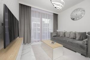 Luxurious Grey Apartment with Furnished Balcony and Parking by Renters