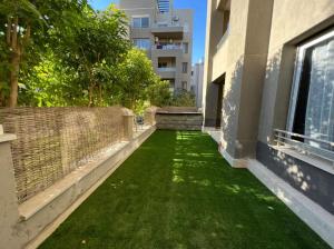 Lovely 2BR Apartment with Garden and Barbecue Area