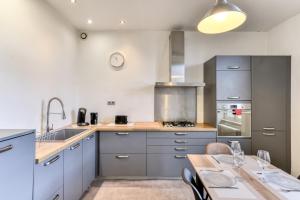 Appartements Le Marty - wifi - central - climatison - parking gratuit : photos des chambres