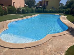 Porto Pino, Garden and Pool
