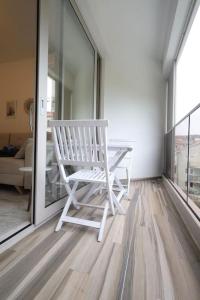 Status-M Apartments Aura