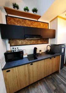 Appartements Maison Romantique/Jacuzzi : photos des chambres