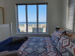 The Bolussi Beachhouse, sleeps 12 in 6 en-suite bedrooms with Indoor Pool