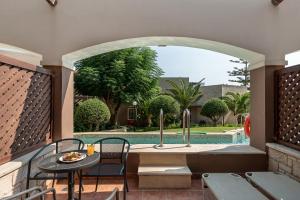 Family Suite with Garden View and Sharing Pool room in Atlantica Creta Paradise