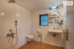 StayVistas Kia Ora - Amidst Greenery Villa with Outdoor Pool, Balconies, and Indoor Games