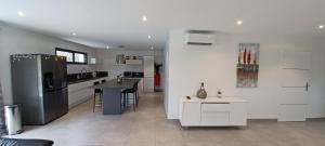 Villas Maison de 120M avec jardin : photos des chambres