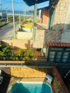 Casa Azul na Praia do Verão Vermelho