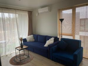 E&K apartamentai su šildomu baseinu kieme