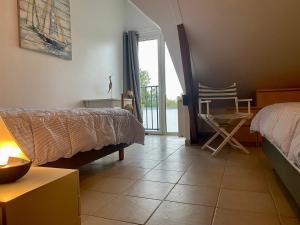 Maisons de vacances Charmante Maison au Coeur d’un Village Paludier, Proche Guerande et Plages, Terrasse et Wifi - FR-1-306-1227 : photos des chambres