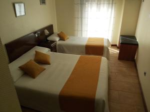 Double Room with Balcony (2 Adults + 1 Child) room in Complutense
