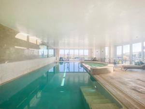 Spinneys Beachfront home, Indoor Pool UK-Vacations