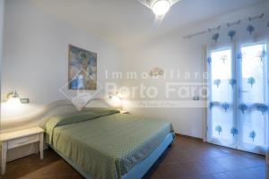 L301 - Bilocale caposchiera con giardino e vista sulla spiaggia di Porto Mannu