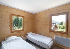 Chalets du Bouchot & Jacuzzi privatif proximite Gerardmer & La Bresse : photos des chambres
