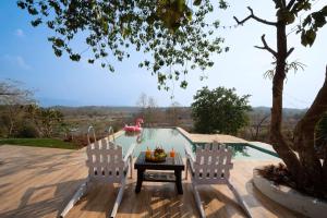 Anjees Chalet by StayVista - Mountain-view villa with Classic wooden interiors, Lush lawn & Snooker table