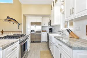 Multi Level Oceanfront Home with Patio on the Beach, Fire pit and 2 car garage
