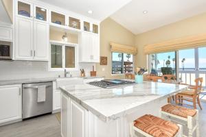 Multi Level Oceanfront Home with Patio on the Beach, Fire pit and 2 car garage