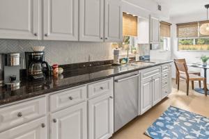 Sunset Greens is a newly renovated 3 bedroom heated pool home in South Tampa with putting green