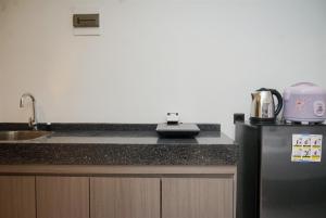 Simply Look Studio Apartment Carstensz Residence By Travelio