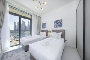 2BR Emaar Beachfront with Full Sea & Skyline Views