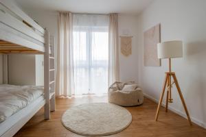 Penthouse-Ferienwohnung Wolfsburg mit Dachterrasse WLAN Smart-TV überdachter Parkplatz Wallbox