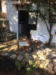 Theisoa.Old Little house in the garden . Andritsaina.