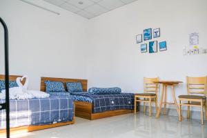 Phòng Deluxe Đôi Với 2 Giường Đôi (Deluxe Double Room with Two Double Beds)