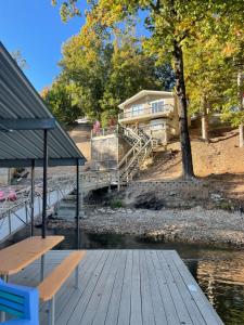 Waterfront on a quiet cove with large dock with lily pad