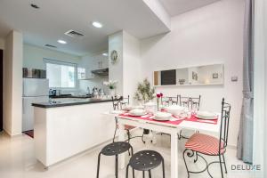 Tranquil 3BR Townhouse at Albizia Damac Hills 2 by Deluxe Holiday Homes