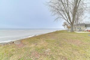 Bright Houghton Lake Home with Boat Dock and Fire Pit