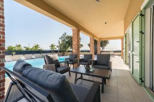 Beach front villa with heated pool, jacuzzi, fantastic view, the sound of the waves - by Traveler tourist agency Krk ID 2404