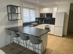 Villas Superbe Maison avec jardin : photos des chambres