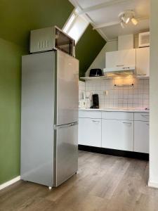 Olivia 6pers House with a private garden close to the National Park Lauwersmeer