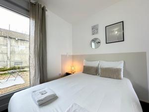 Appartements LE CHIC - Terrasse & Parking : photos des chambres