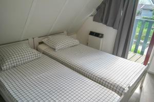 Lilian Modern Holiday home at a typical dutch canal, close to the Lauwersmeer