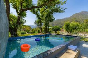 Prakriti with River View- Pet Friendly Retreat with Plunge Pool by StayVista