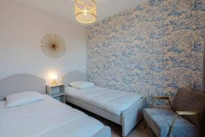 Appartements Le Cabourgeais centre ville : photos des chambres