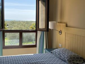 PRIMERA PLANTA DOS DORMITORIOS URB. JARDINES DE ISLA CANELA BY SIT ISLA CANELA