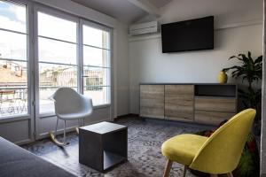 Appartements L'amoureux - terrasse et climatisation coeur de ville : photos des chambres
