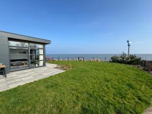 Enkhuizer Strand Chalet Meeresrauschen Erste Reihe mit Zaun Haus Nr 249