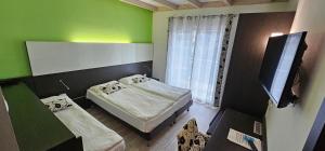 Triple Room with Balcony room in Ecohotel Primavera