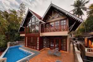 SaffronStays Tudor San Ann - 5BR Candolim villa with infinity pool, lift & sunrise-view rooms near beach