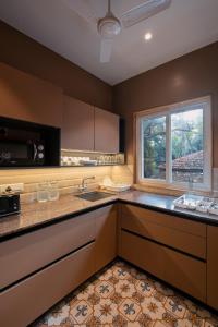 SaffronStays Tudor San Ann - 5BR Candolim villa with infinity pool, lift & sunrise-view rooms near beach