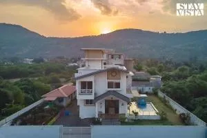 StayVista's Kaarma Villa - Valley-View Villa with Outdoor Pool, Lawn featuring a Gazebo & Machan - Somavadi