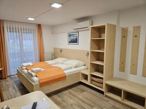 Quadruple Room with Balcony and Mountain View room in Hotel Gasperin Bohinj